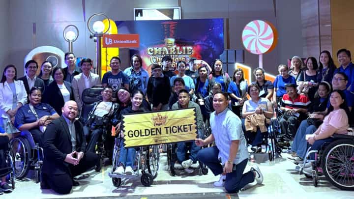 UnionBank representatives, Tahanang Walang Hagdanan Inc. beneficiaries and community partners pose for a photo after watching Charlie and the Chocolate Factory: The Musical at The Theatre at Solaire.