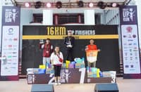 ROY Laudit (middle) celebrates on the podium after ruling the men’s 16K event of The Great UP Run on Sunday at the UP Diliman Grounds. Also shown are winners Joel Orogan and Mark Anthony Oximar.