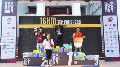 ROY Laudit (middle) celebrates on the podium after ruling the men’s 16K event of The Great UP Run on Sunday at the UP Diliman Grounds. Also shown are winners Joel Orogan and Mark Anthony Oximar.
