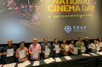 Key Philippine film industry stakeholders hold up their signed memorandum of agreement for National Cinema Day, set for 12 September.