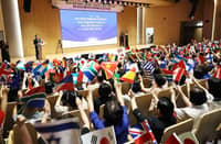 Religious leaders and delegates from various countries wave their national flags during the 1st Joint Assembly of World Pastors in South Korea on 13 August 2026.