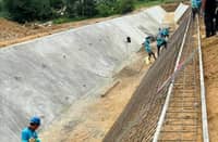 Officials from the National Irrigation Administration supervise the rehabilitation of the Jalaur River Multipurpose Project Stage II in Iloilo.