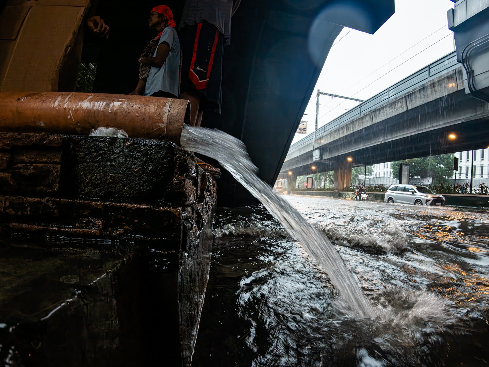 A downspout at a train station along Taft Avenue in Manila discharges rainwater directly onto the street as heavy rains brought by the southwest monsoon inundate the major thoroughfare on 29 August 2026. In May, MMDA General Manager Nicolas Torre III flagged establishments and infrastructure projects with downspouts that discharged rainwater onto streets instead of into the drainage system.