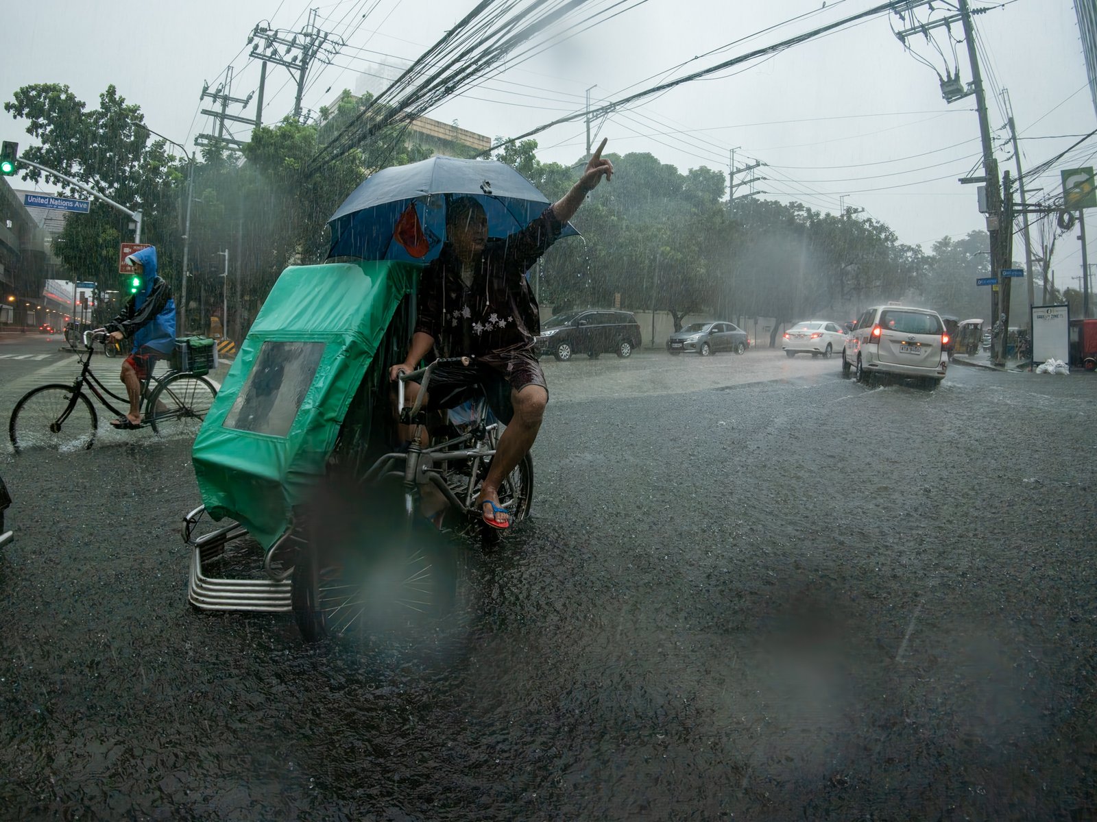 Floodwaters cover a road at the corner of Taft Avenue and UN Avenue in Manila on 29 August 2026, as heavy rains brought by the southwest monsoon, or habagat, inundated parts of the capital. PAGASA issued a Red Rainfall Warning for Metro Manila, warning of serious flooding in low-lying and flood-prone areas.