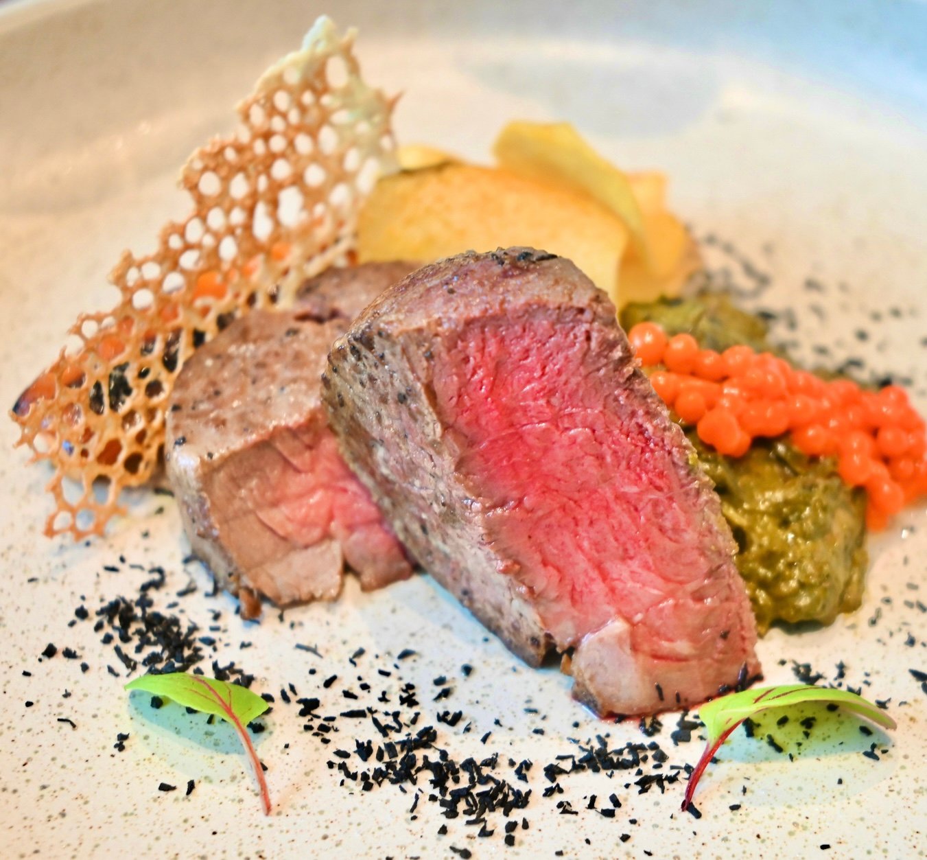 LAKAS (strength), expressed through baka, gata, laing featuring beef tenderloin, burnt coconut, labuyo pearl and creamed taro leaves, honoring the rich culinary heritage of the Bicol Region.