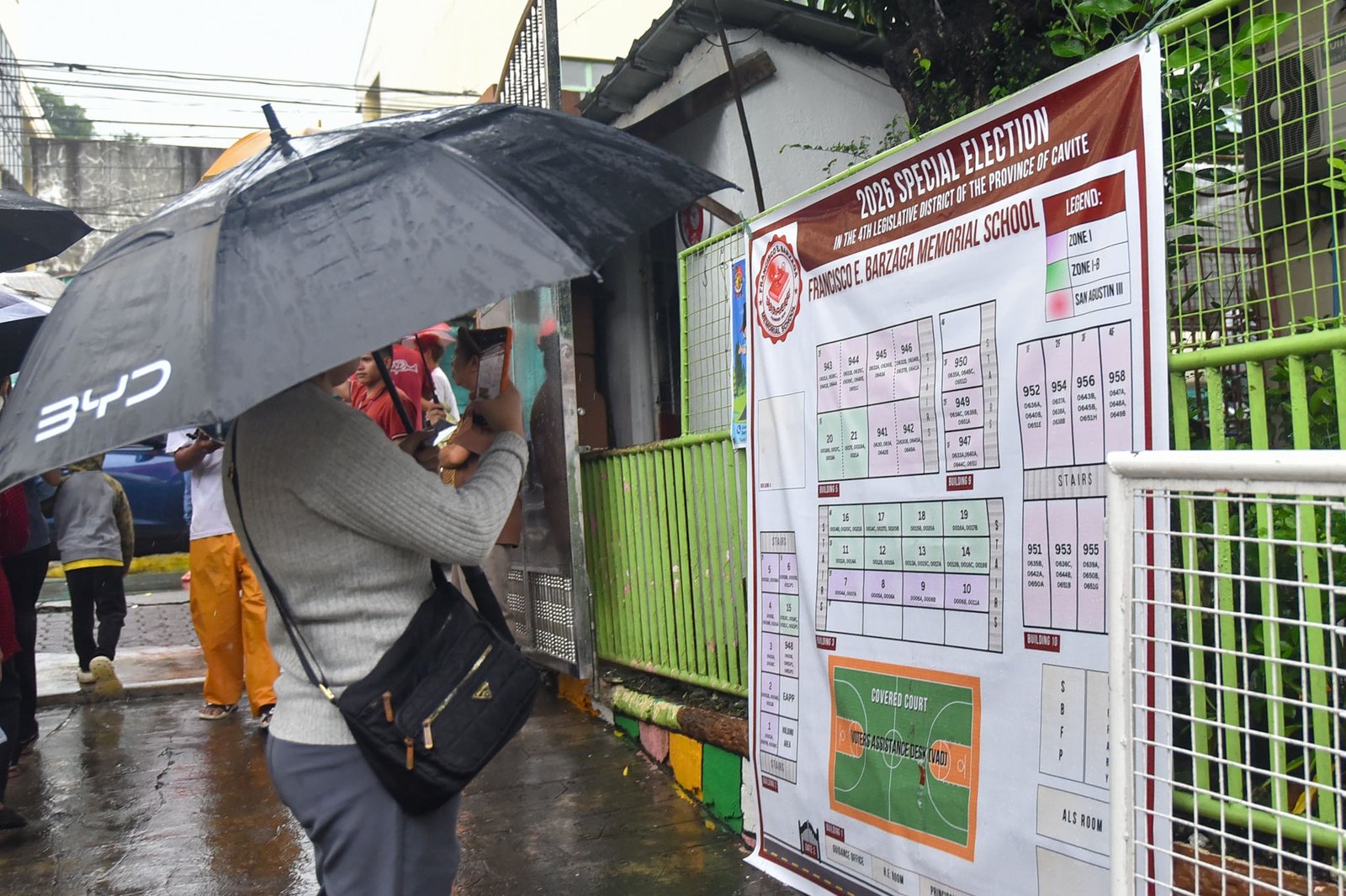 Despite continuous heavy rain, voters in Dasmariñas city brave through the rain for the special elections for Cavite’s 4th District today, August 29. l Zedrich Xylak Madrid