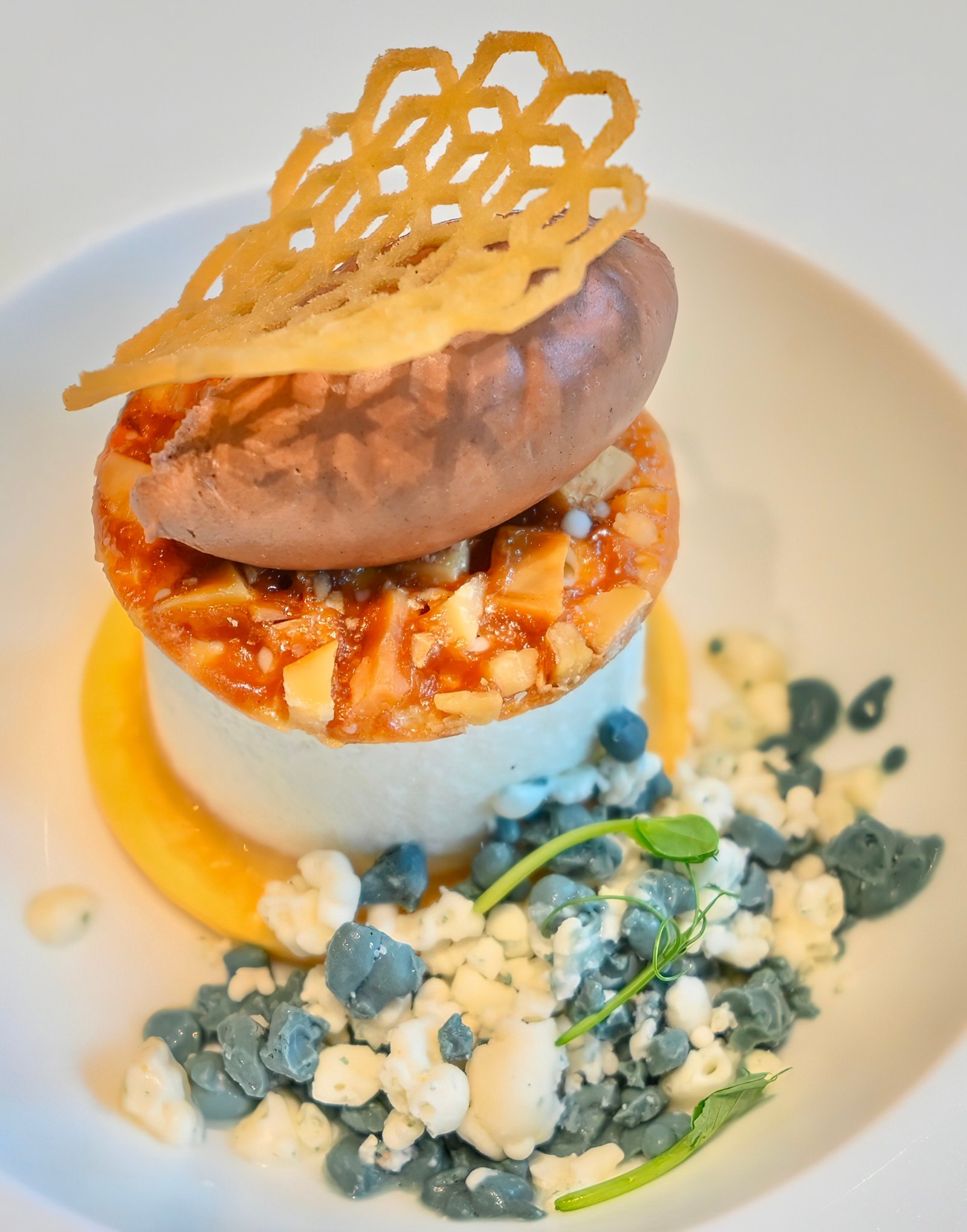THE sweet finale, pamana (legacy), is presented as guyabano and kakaw (guyabano chiboust, cacao crème, San Nicolas cookie, pili florentine, and guyabano pearls), inspired by the culinary traditions of Davao, the Cacao Capital of the Philippines.
