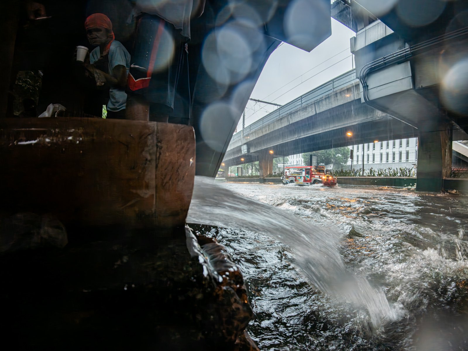 A downspout at a train station along Taft Avenue in Manila discharges rainwater directly onto the street as heavy rains brought by the southwest monsoon inundate the major thoroughfare on 29 August 2026. In May, MMDA General Manager Nicolas Torre III flagged establishments and infrastructure projects with downspouts that discharged rainwater onto streets instead of into the drainage system.