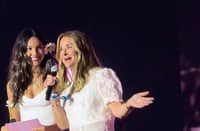 Olivia Rodrigo and philanthropist Melinda French Gates onstage at the Daisy Chain Fields Festival.