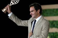 ROGER Federer lifts his golden racket during the International Tennis Hall of Fame 2026 Induction Ceremony in Newport, Rhode Island.