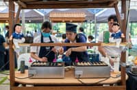 TZU Chi youth volunteers cook Takoyaki while Betty Dizon (below) prepare crunchy, plant-based, deep-fried chicken cutlets at the Tzu Chi’s food bazaar held at the Buddhist Tzu Chi Campus in Sta. Mesa, Manila on 22 and 23 August.
