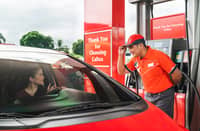 CALTEX staff assist a motorist at the pump as the brand advises drivers to consider fuel formulation and engine-cleaning additives.