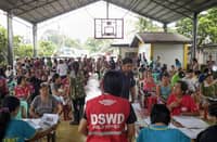PERSONNEL from the Department of Social Welfare and Development Field Office 1 distribute family food packs to storm-affected residents in Pangasinan as relief operations continue across the province following recent typhoons and the southwest monsoon.