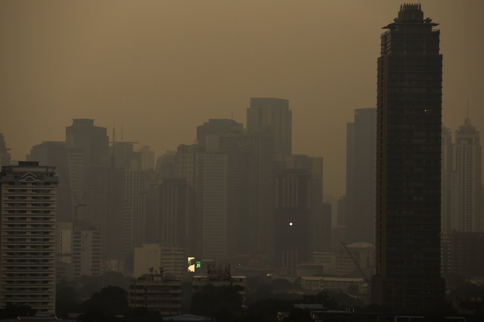 A thick haze blankets the Metro Manila skyline at 6:01am on 01 September 2026 as smoke from wildfires in Kalimantan is carried toward the Philippines by cross-equatorial winds. Air quality monitoring sensors across Metro Manila recorded AQI levels ranging from Unhealthy for Sensitive Groups to Very Unhealthy. Local government units, including Quezon City, have suspended face-to-face classes at all levels in public schools amid the poor air quality.