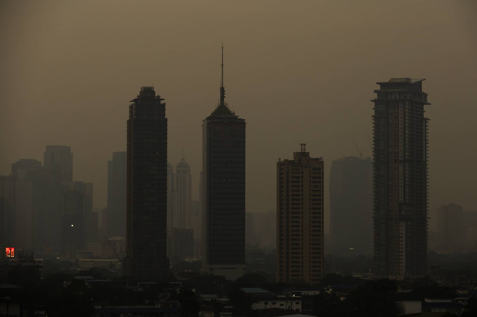 A thick haze blankets the Metro Manila skyline at 6:01am on 01 September 2026 as smoke from wildfires in Kalimantan is carried toward the Philippines by cross-equatorial winds. Air quality monitoring sensors across Metro Manila recorded AQI levels ranging from Unhealthy for Sensitive Groups to Very Unhealthy. Local government units, including Quezon City, have suspended face-to-face classes at all levels in public schools amid the poor air quality.