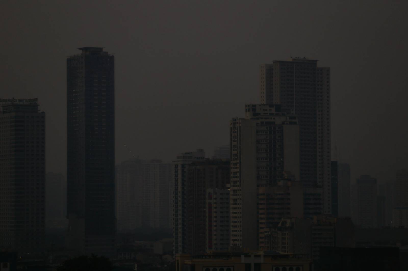 A thick haze blankets the Metro Manila skyline at 6:01am on 01 September 2026 as smoke from wildfires in Kalimantan is carried toward the Philippines by cross-equatorial winds. Air quality monitoring sensors across Metro Manila recorded AQI levels ranging from Unhealthy for Sensitive Groups to Very Unhealthy. Local government units, including Quezon City, have suspended face-to-face classes at all levels in public schools amid the poor air quality.