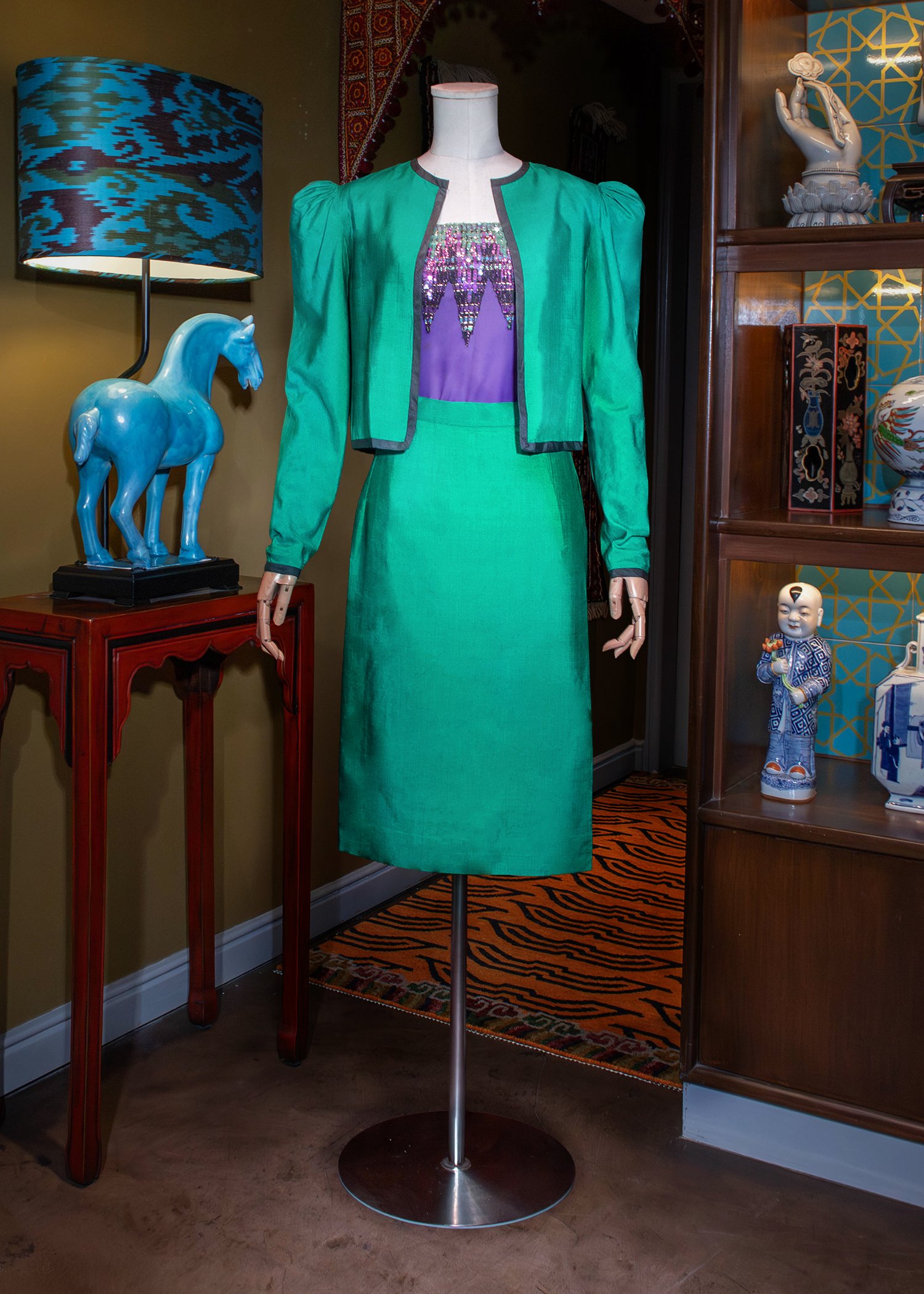 Three-piece ensemble comprising a blue-green Shantung silk blazer and a wrap pencil skirt, paired with a purple sequined chiffon tube top.