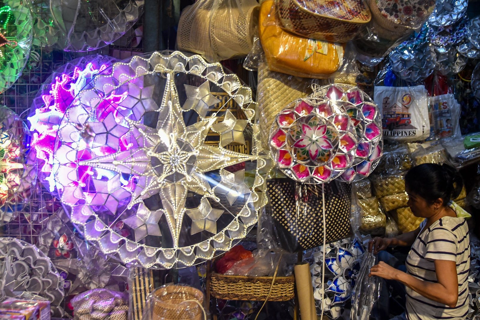 Christmas lanterns and other handicrafts are displayed in stalls under Quezon Bridge in Manila on August 31, ahead of the start of 'Ber' months. | Zedrich Xylak Madrid