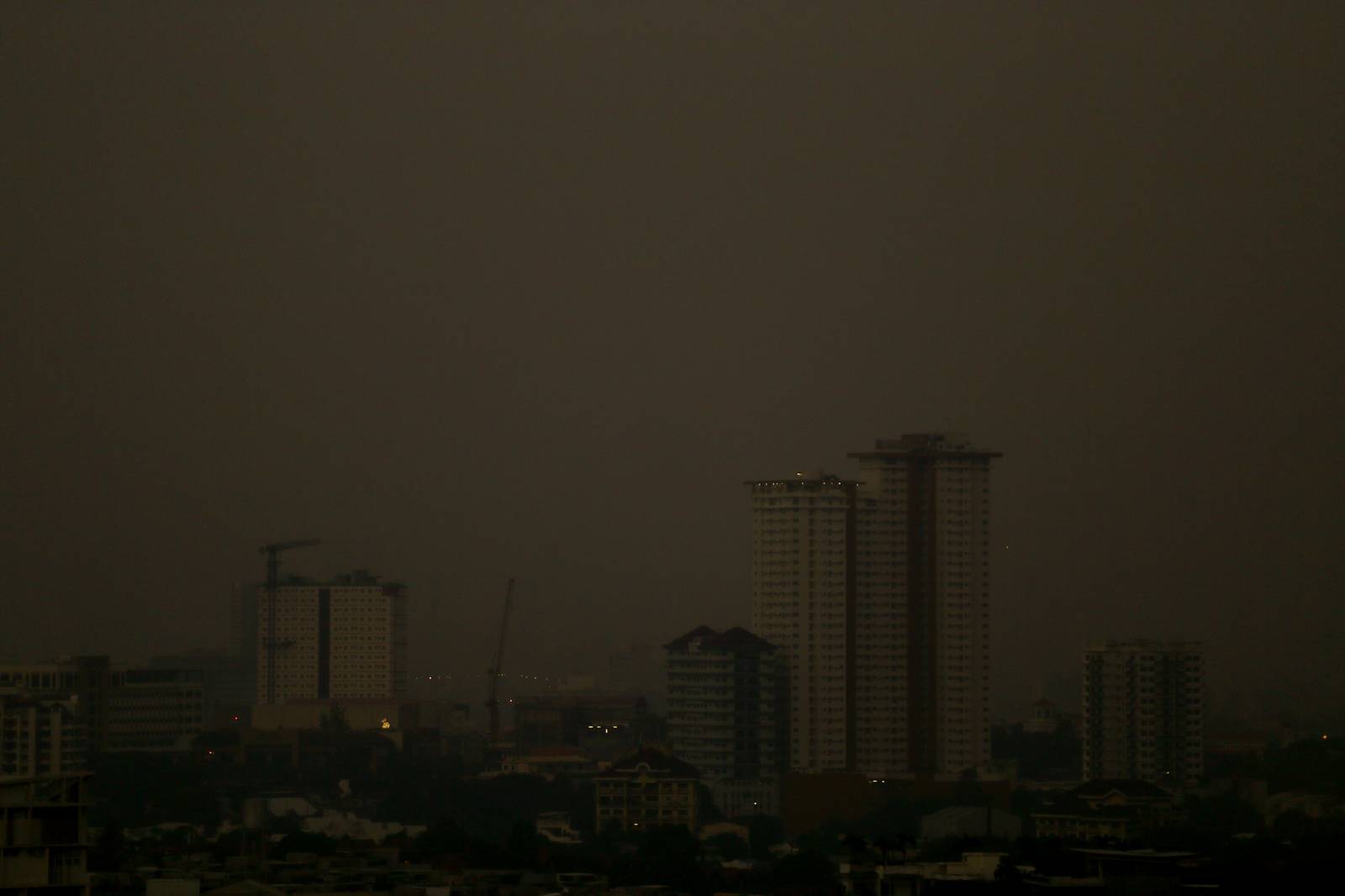 A thick haze blankets the Metro Manila skyline at 6:01am on 01 September 2026 as smoke from wildfires in Kalimantan is carried toward the Philippines by cross-equatorial winds. Air quality monitoring sensors across Metro Manila recorded AQI levels ranging from Unhealthy for Sensitive Groups to Very Unhealthy. Local government units, including Quezon City, have suspended face-to-face classes at all levels in public schools amid the poor air quality.