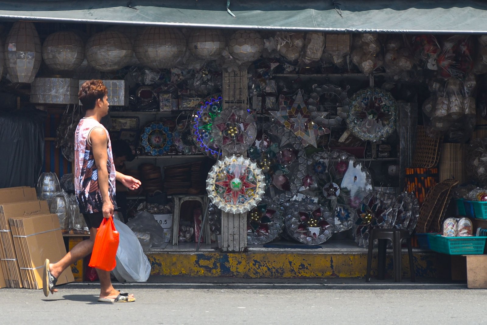 Christmas lanterns and other handicrafts are displayed in stalls under Quezon Bridge in Manila on August 31, ahead of the start of 'Ber' months. | Zedrich Xylak Madrid