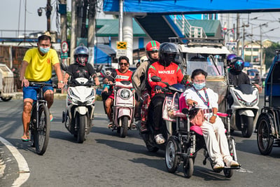 Commuters wear masks amid unhealthy air quality in Manila