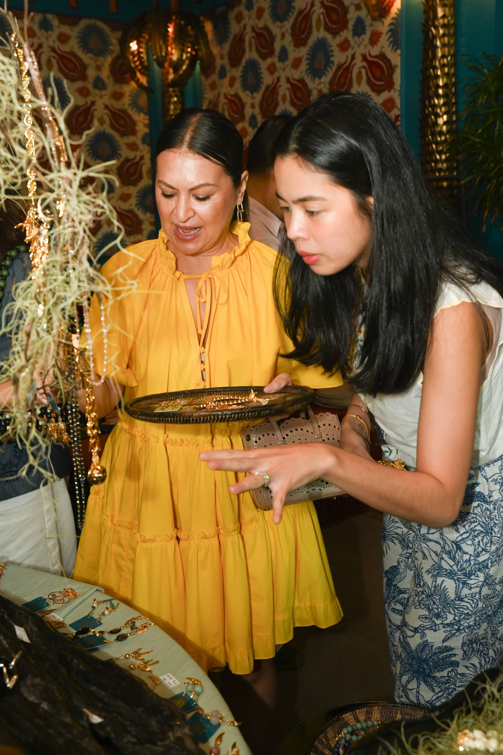 Marilu Batchelor and Ella Pangilinan Miranda choose their favorite bracelets