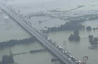 Seen from above, NLEX becomes a narrow line through a flooded landscape.