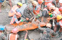 SOLDIERS carry a worker who was trapped inside a tunnel, during a rescue operation at Trishuli-3A Hydropower Project in Nepal’s Rasuwa district.