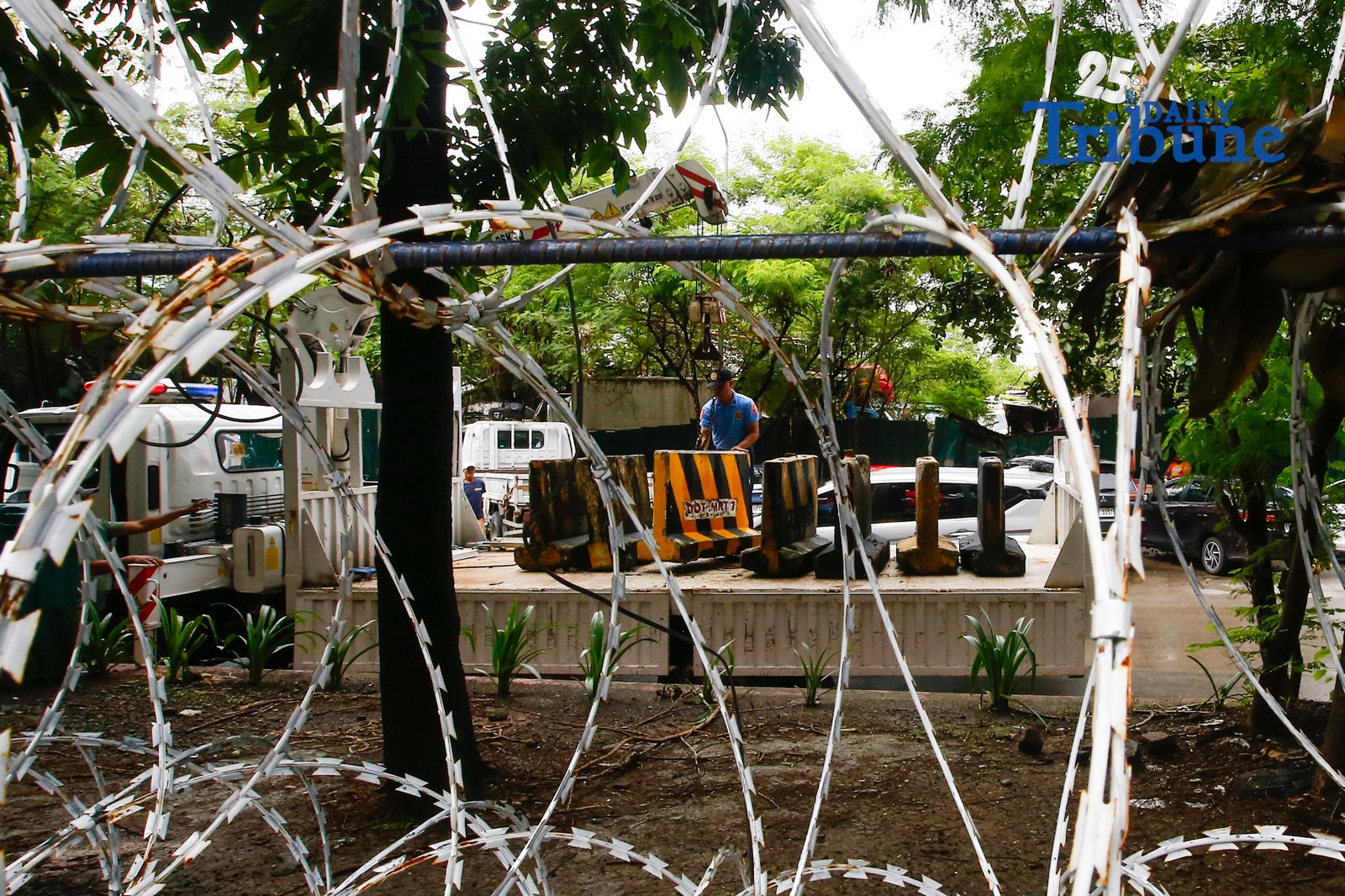 Personnel unload concrete barriers at the center island of J.W. Diokno Boulevard in front of the Philippine Senate in Pasay City on 05 September 2026. Authorities are tightening security around the Senate as the impeachment trial of Vice President Sara Duterte continues.