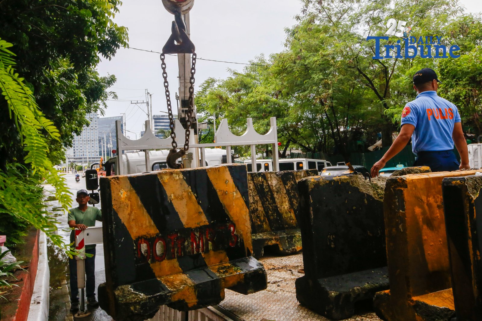 Personnel unload concrete barriers at the center island of J.W. Diokno Boulevard in front of the Philippine Senate in Pasay City on 05 September 2026. Authorities are tightening security around the Senate as the impeachment trial of Vice President Sara Duterte continues.