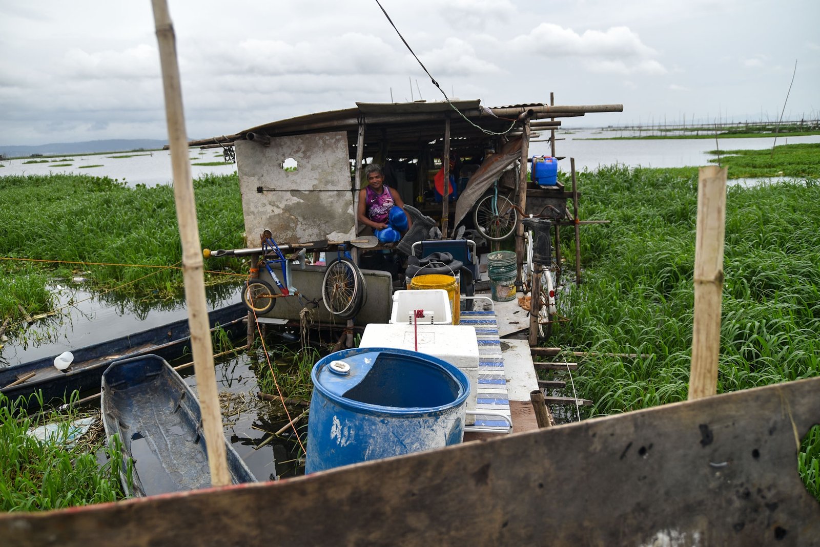 Fisherman Eddy Casin, 46, stands near his makeshift home beside the Lakeshore Complex in Taguig City on 5 September. Casin said the nearby reclamation project has hurt his livelihood, making it harder to earn from fishing and meet his daily needs. | Zedrich Xylak Madrid