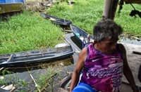 Fisherman Eddy Casin, 46, stands near his makeshift home beside the Lakeshore Complex in Taguig City on 5 September. Casin said the nearby reclamation project has hurt his livelihood, making it harder to earn from fishing and meet his daily needs.