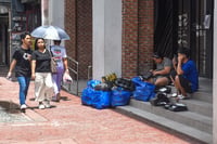 Delivery riders along España, Manila 