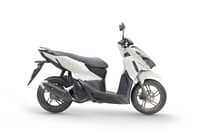 PROFILE highlights the scooter’s Pearl Arctic White finish, dark lower panels and bronze-colored wheels.