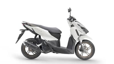 PROFILE highlights the scooter’s Pearl Arctic White finish, dark lower panels and bronze-colored wheels.