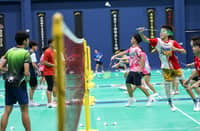 STUDENT-ATHLETES train for badminton inside the completed Sports Performance Building at the Bases Conversion and Development Authority property in New Clark City in Capas, Tarlac.