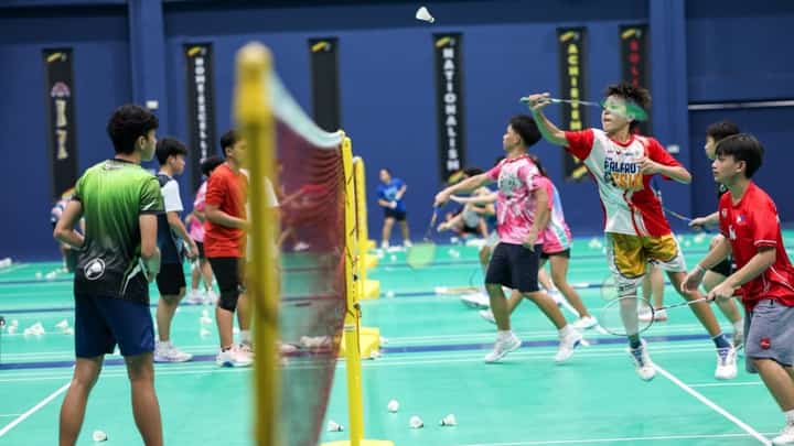 STUDENT-ATHLETES train for badminton inside the completed Sports Performance Building at the Bases Conversion and Development Authority property in New Clark City in Capas, Tarlac.