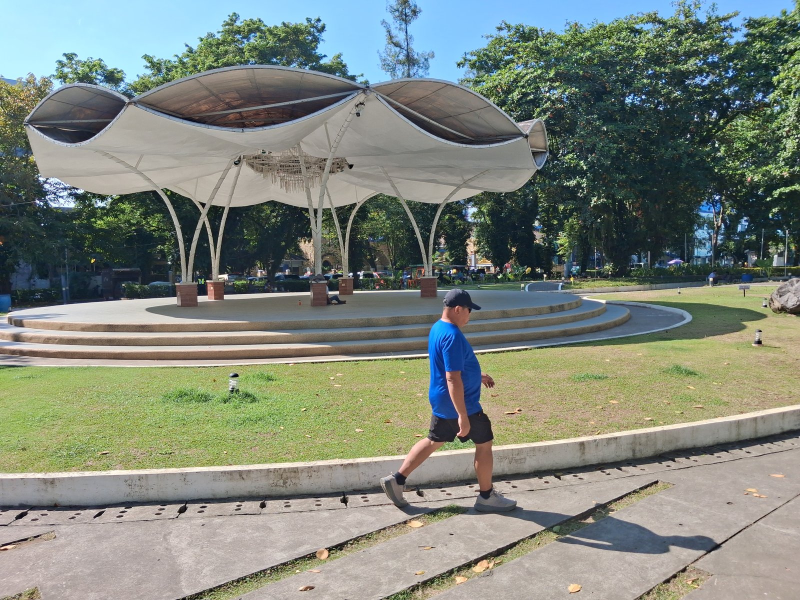 ADULT man walking in Plaza Magsaysay.