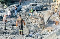 AN excavator digs as rescuers search for survivors amid the rubble following an overnight Israeli airstrike on the village of Kfar Roummane in southern Lebanon on 7 September 2026.