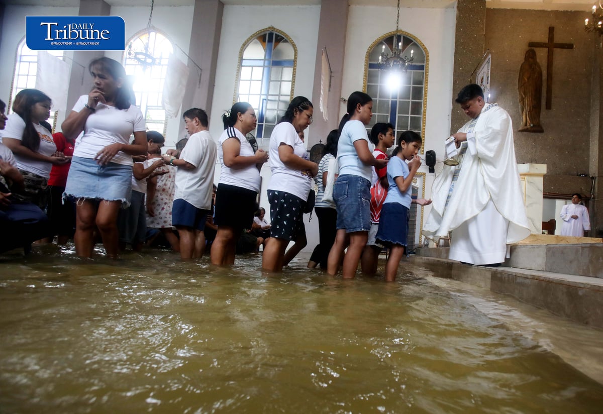 FAITH ABOVE THE FLOODWATERS

Floodwaters fail to deter devotees from attending Mass at St. John the Baptist Parish Church in Barangay San Juan, Hagonoy, Bulacan, on Tuesday, 8 September 2026, to celebrate the Nativity of the Blessed Virgin Mary.

The village has remained flooded for about a month due to persistent monsoon rains.

Photo by Analy Labor