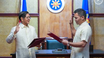 President Ferdinand Marcos Jr. swears in Manny Pacquiao as the new anti-poverty czar of his administration in Malacanang on Tuesday.