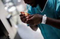 A PATIENT smokes in the enclosed smoking area of the Enhanced Psychiatric Emergency Centre part of the Delafontaine Hospital in Saint-Denis, north of Paris.
