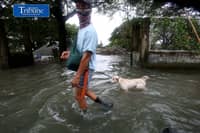 GEARING UP AGAINST FLOOD RISKS
Residents of Barangay San Juan in Hagonoy, Bulacan, wear protective gear while wading through floodwaters on Tuesday, 8 September 2026, in an effort to reduce their exposure to leptospirosis and other health risks.
The barangay has remained flooded for about a month due to persistent monsoon rains.
Photo by Analy Labor