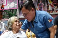 SENATOR Christopher ‘Bong’ Go distributes grocery packs and financial assistance to Pasay City residents in Barangay 178 on Thursday following a fire that displaced 29 families.
