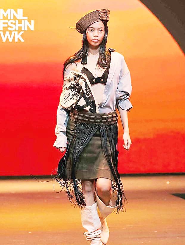 ASYMMETRICAL grey shirt and a roped-fringe skirt from Eugene Malabad's Kill Joy Studios collection.