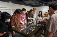 A GROUP examines historical Philippine currency on display at the BSP Hub in Manila, highlighting the country’s rich monetary history and evolution.