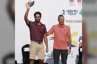 JULIEN Sale (left) acknowledges cheers from the gallery before he was presented the championship trophy by NGAP president Al Panlilio last year.