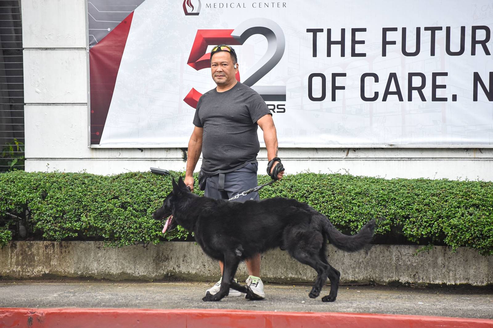 Senator JV. Ejercito is seen walking his dog outside the Cardinal Santos Medical Center in San Juan City, on September 12. l Zedrich Xylak Madrid