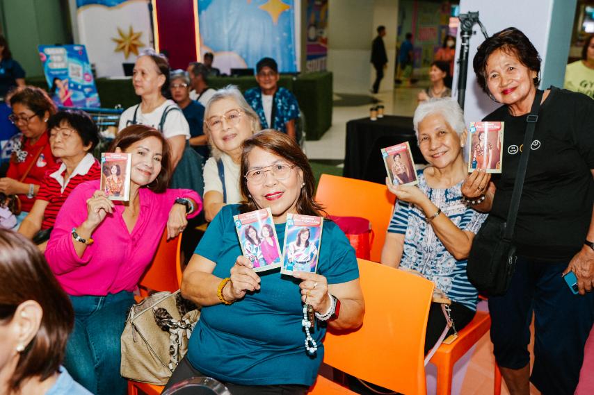 HAPPY grandparents proudly show their freebies.