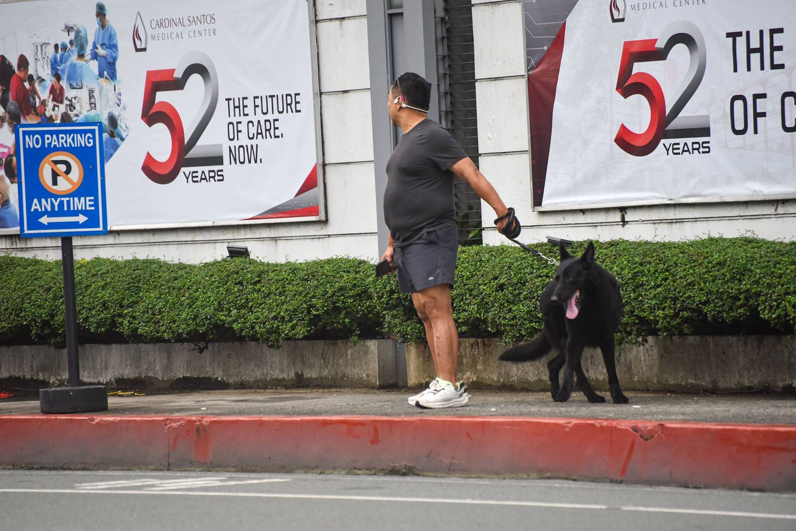 Senator JV. Ejercito is seen walking his dog outside the Cardinal Santos Medical Center in San Juan City, on September 12. l Zedrich Xylak Madrid